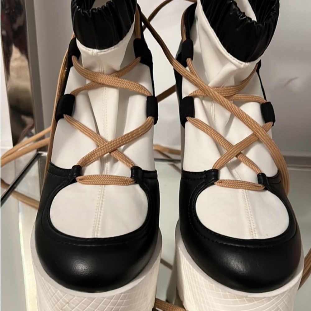 CHANEL Black and White High-Top Sneakers